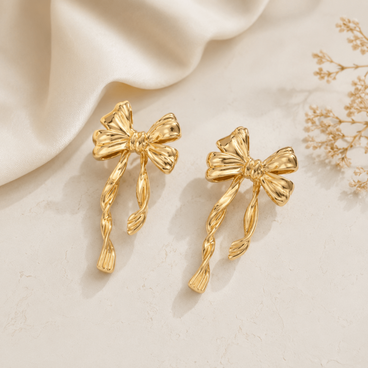 Twisted Ribbon Bow Earrings | Gold Statement Drop Studs for Women - Pettlez Jewellery